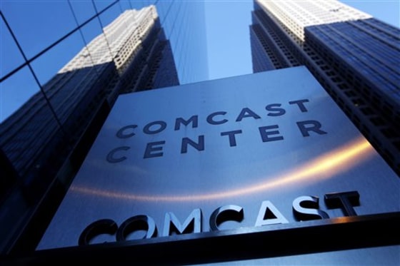 Comcast Corp. reported an 8.6 percent drop in second-quarter earnings Wednesday partly because of costs related to its pending takeover of NBC Universal.